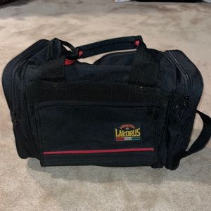 Lakorus small black mini duffle  approximately 10”H X 15”W X 6 1/2-7” opening.